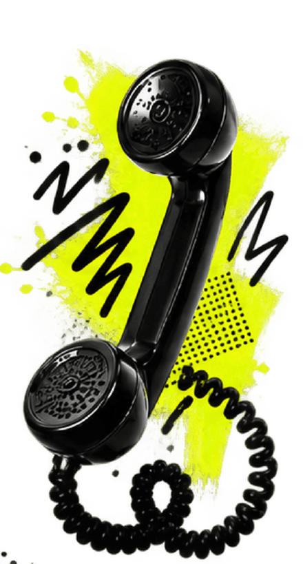 The OnlyComz telephone: a glossy black handset standing upright on a lime painted panel with black zigzag doodles, and its coiled cord curling below it.